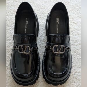 ZUMY black patent leather lug sole loafers